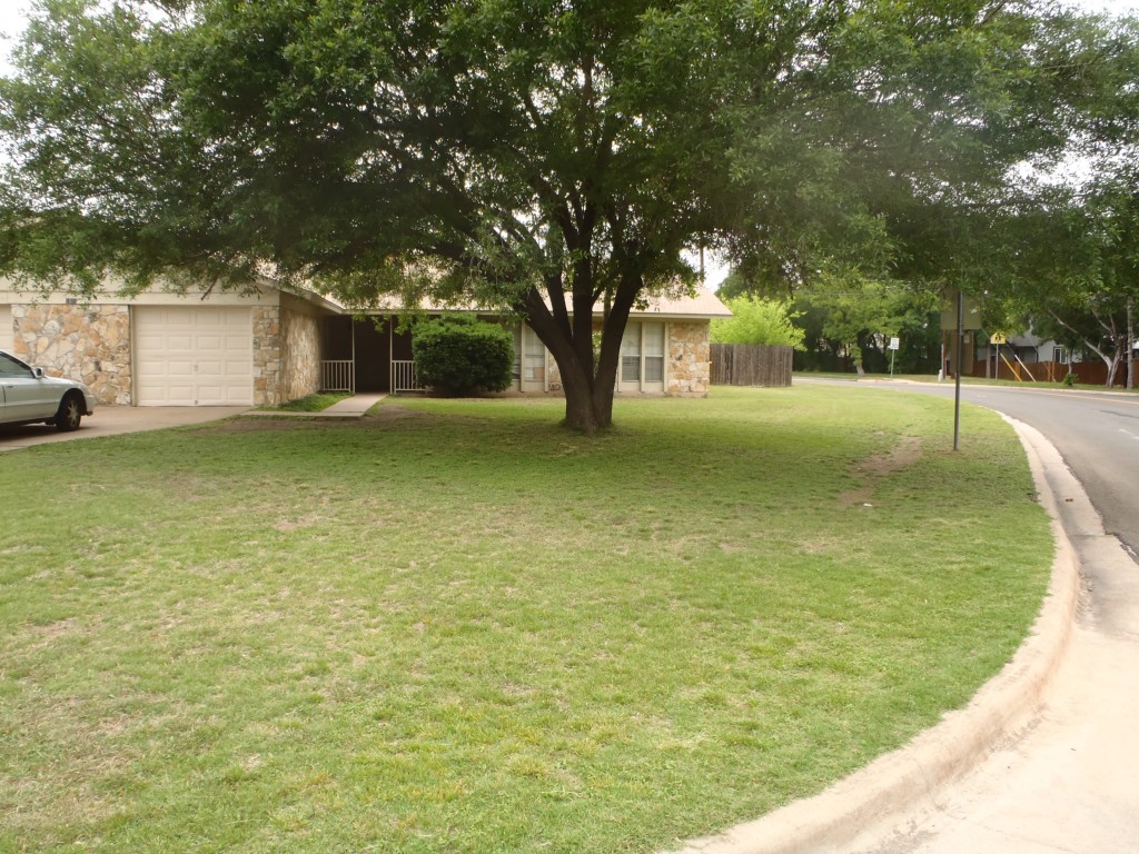 a view of pool with a trees