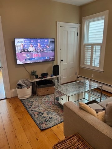 a living room with rug and a couch