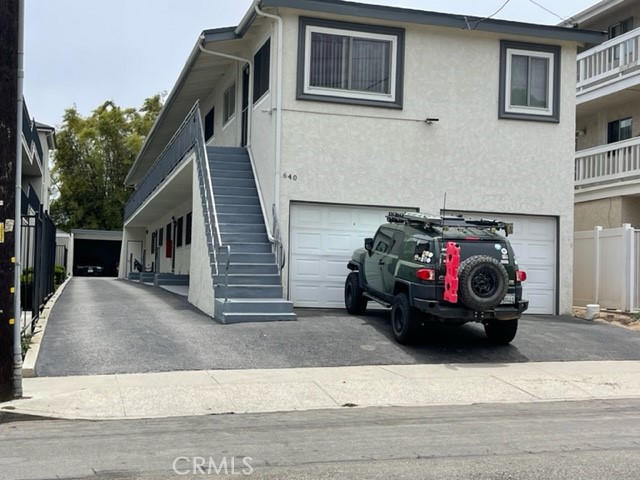 a view of a car in front of a house