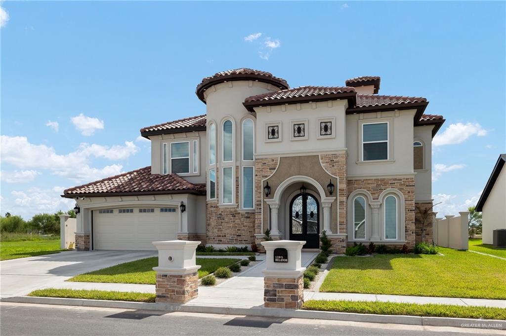 a view of a house with swimming pool and a yard