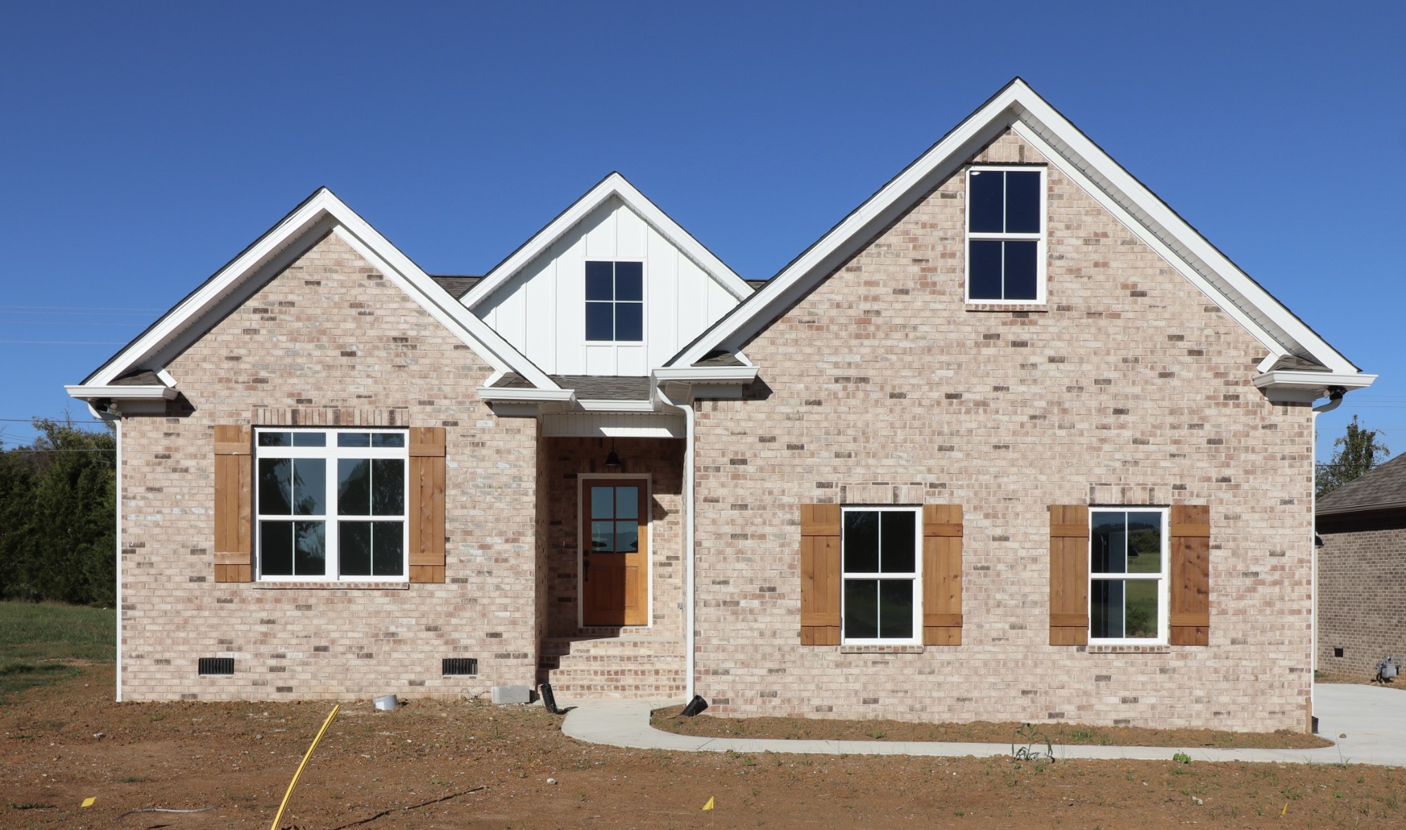 a front view of a house with garage