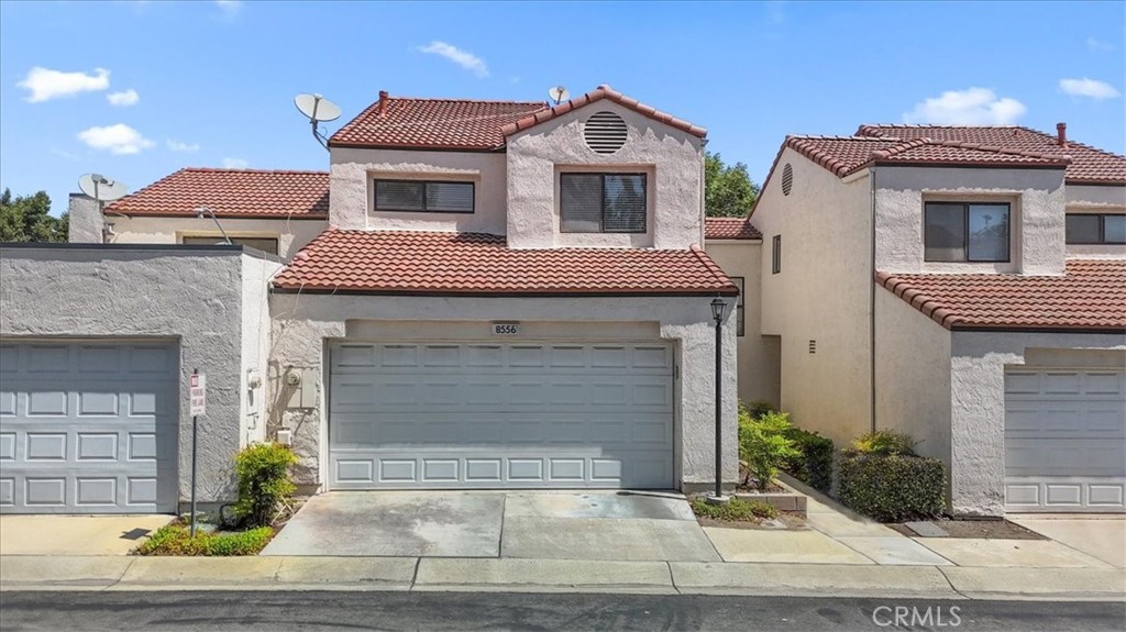 a front view of a house with yard