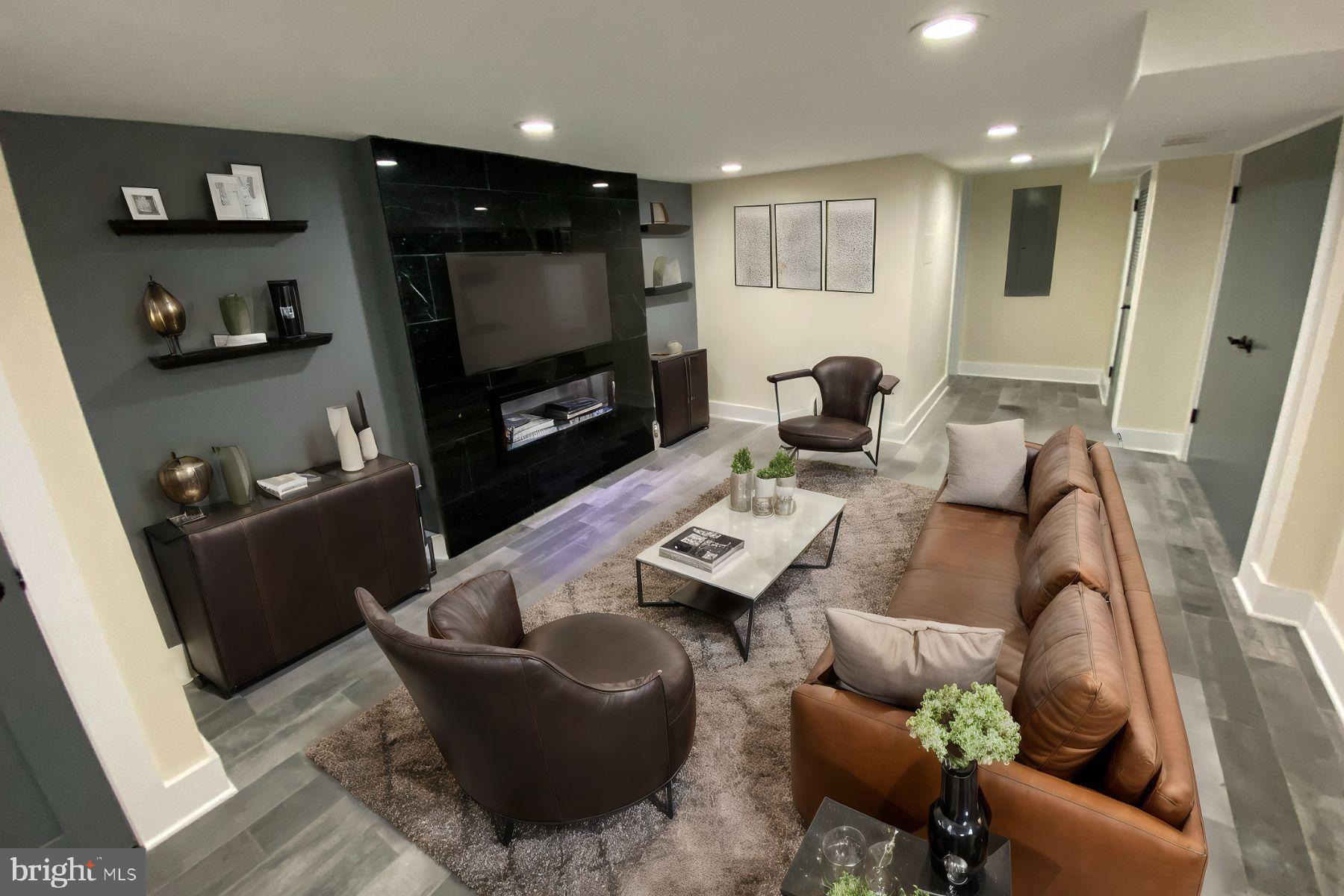 a living room with furniture and a flat screen tv