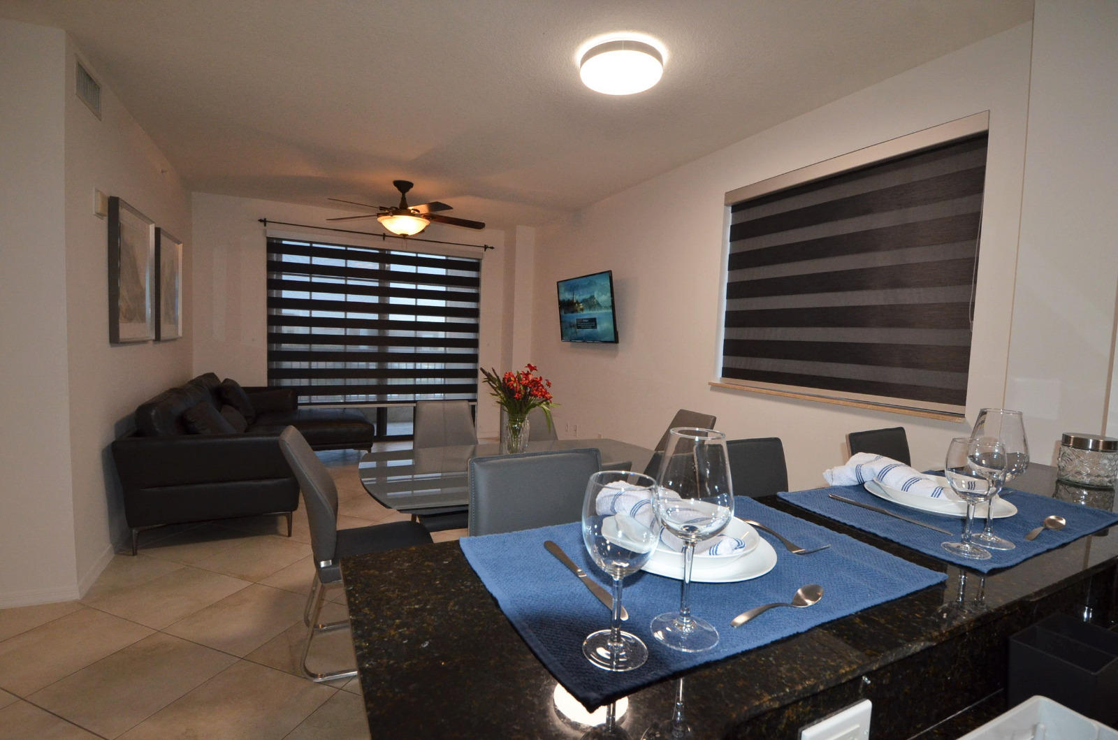 a dining room with furniture and wooden floor