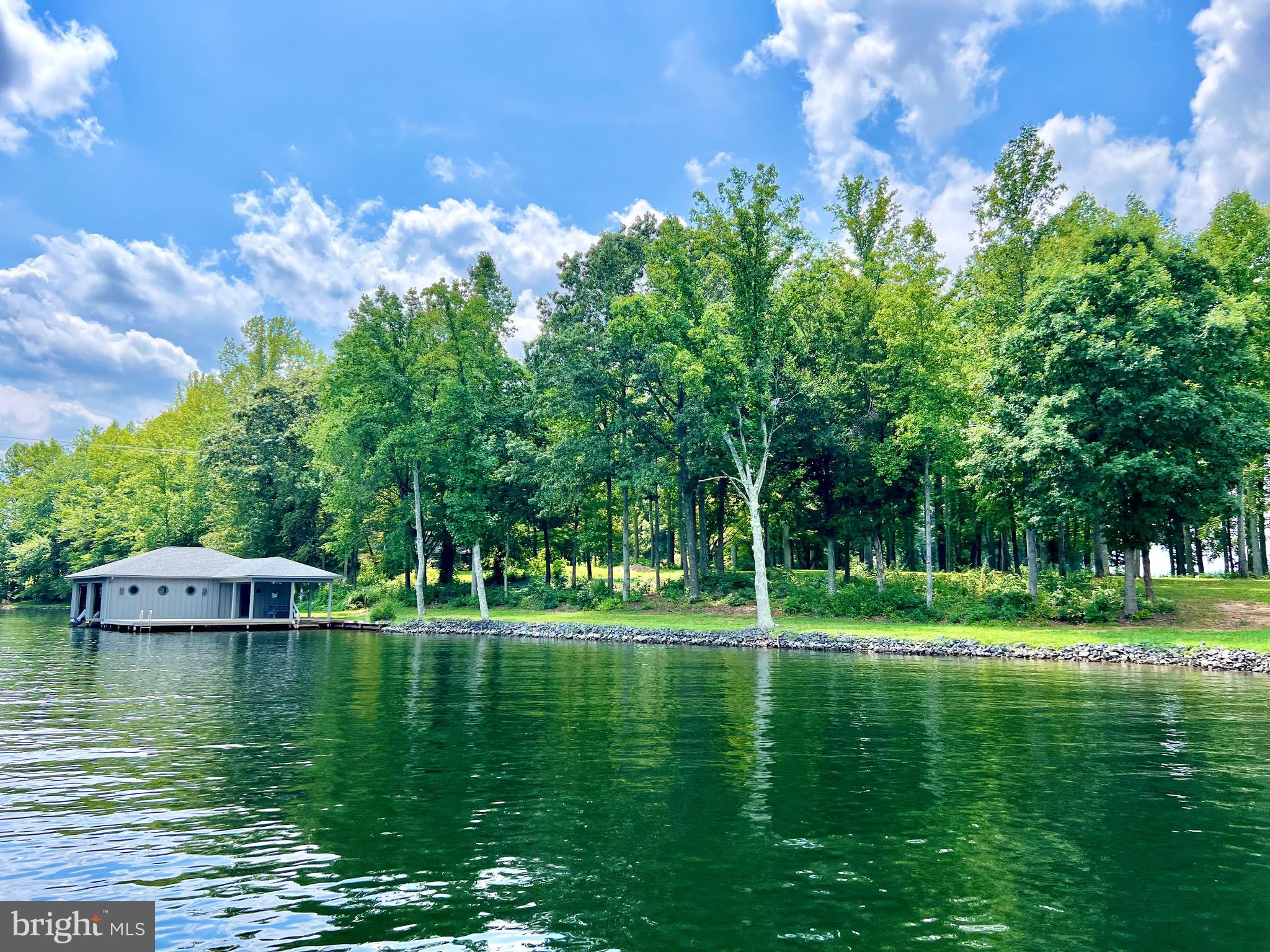 a view of a lake with a big yard