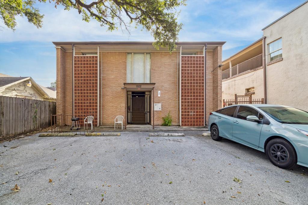 a front view of a house with parking area