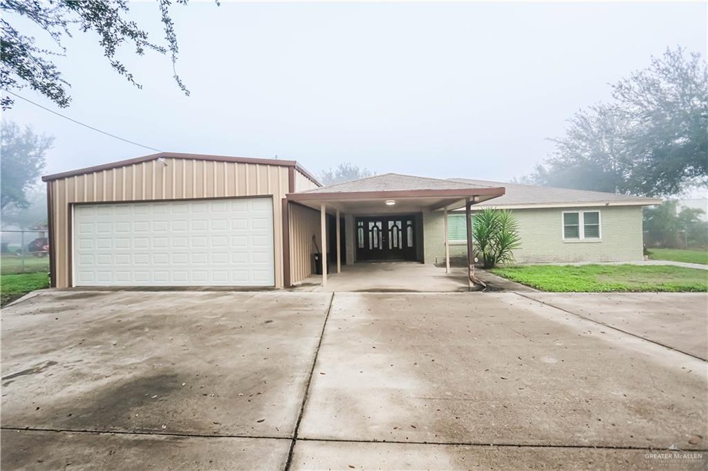 View of front facade featuring a carport