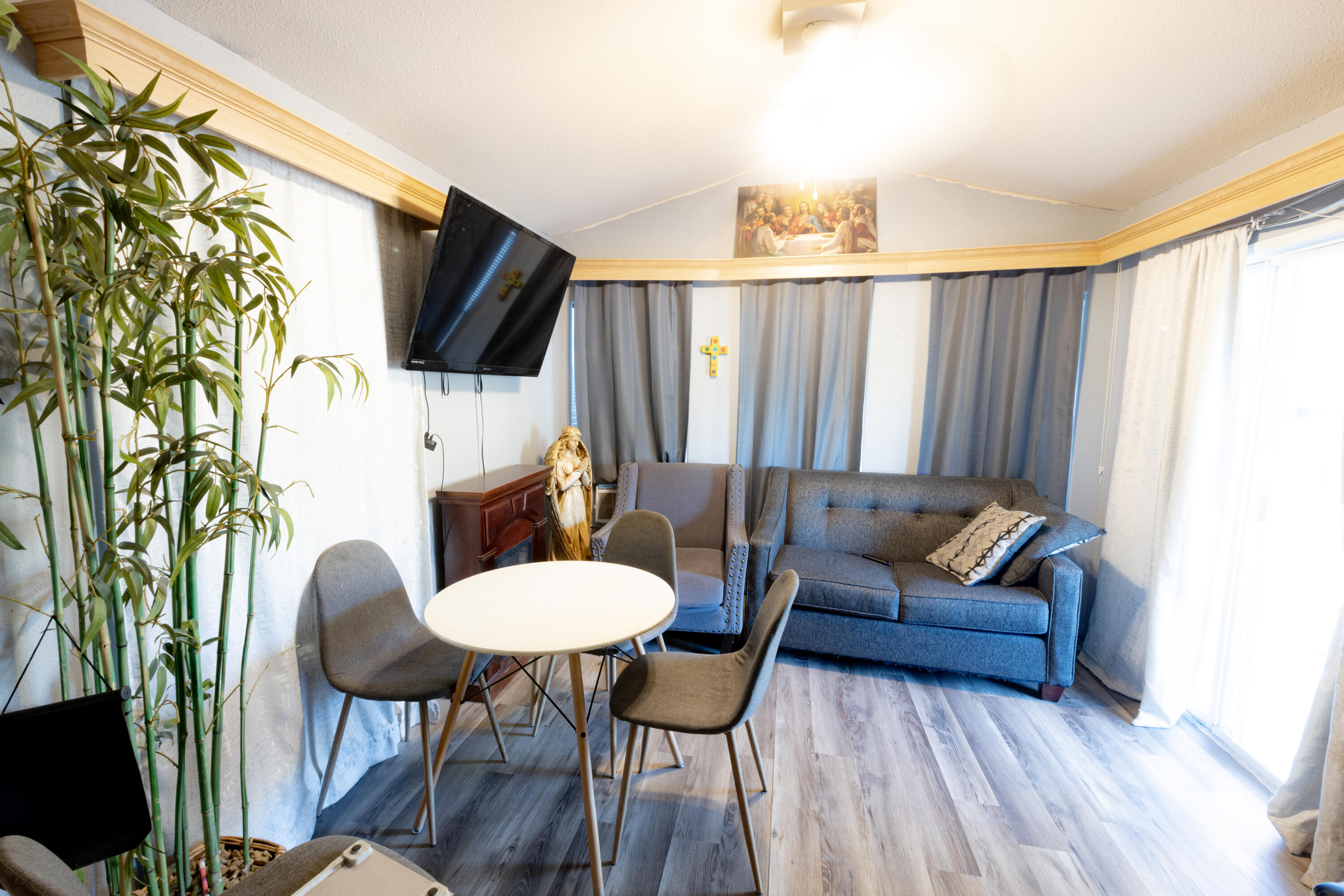 a living room with furniture and a flat screen tv