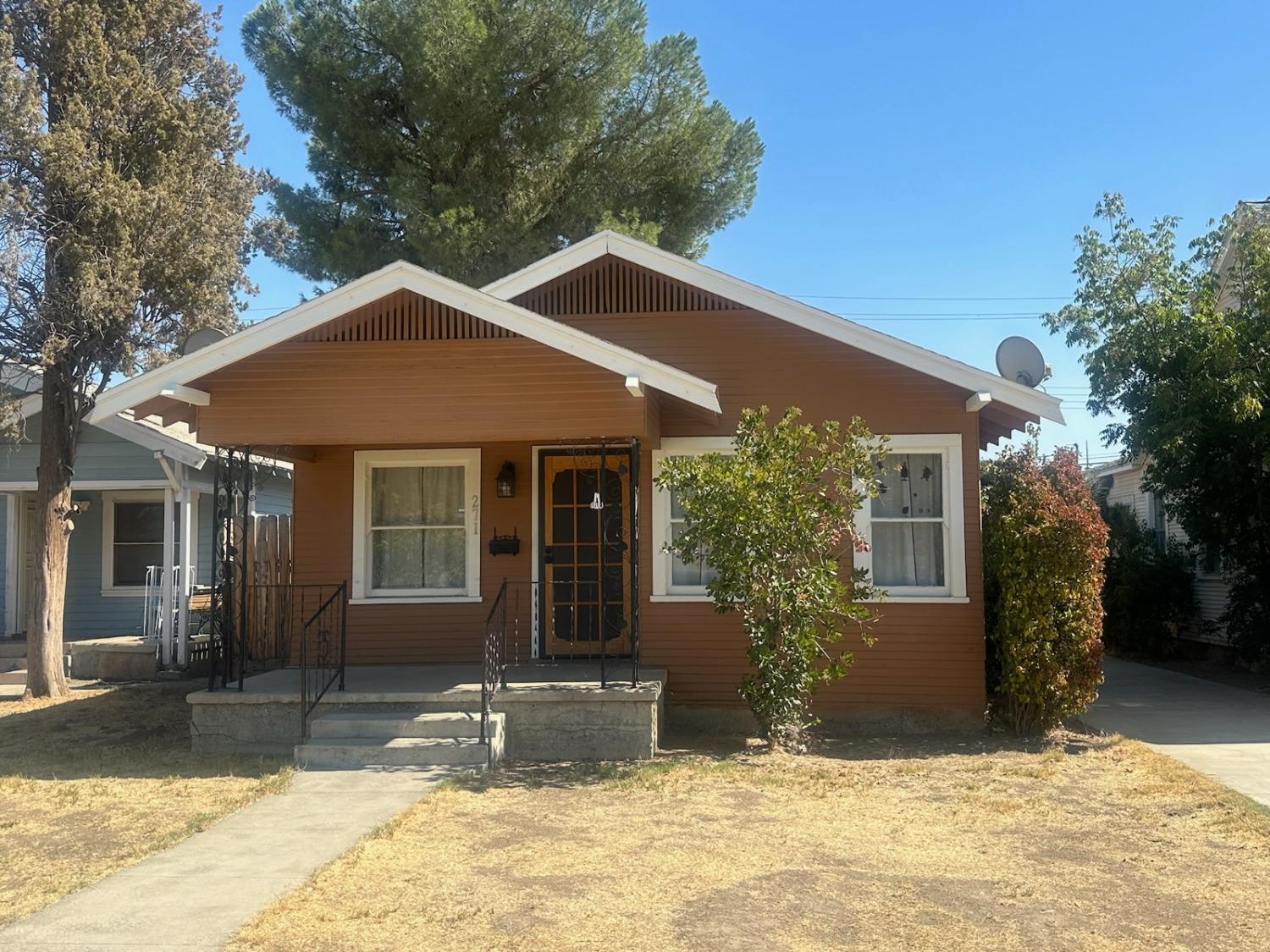 a front view of a house with a yard outdoor seating and yard