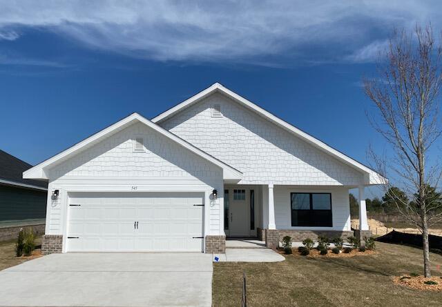 a front view of house with garage