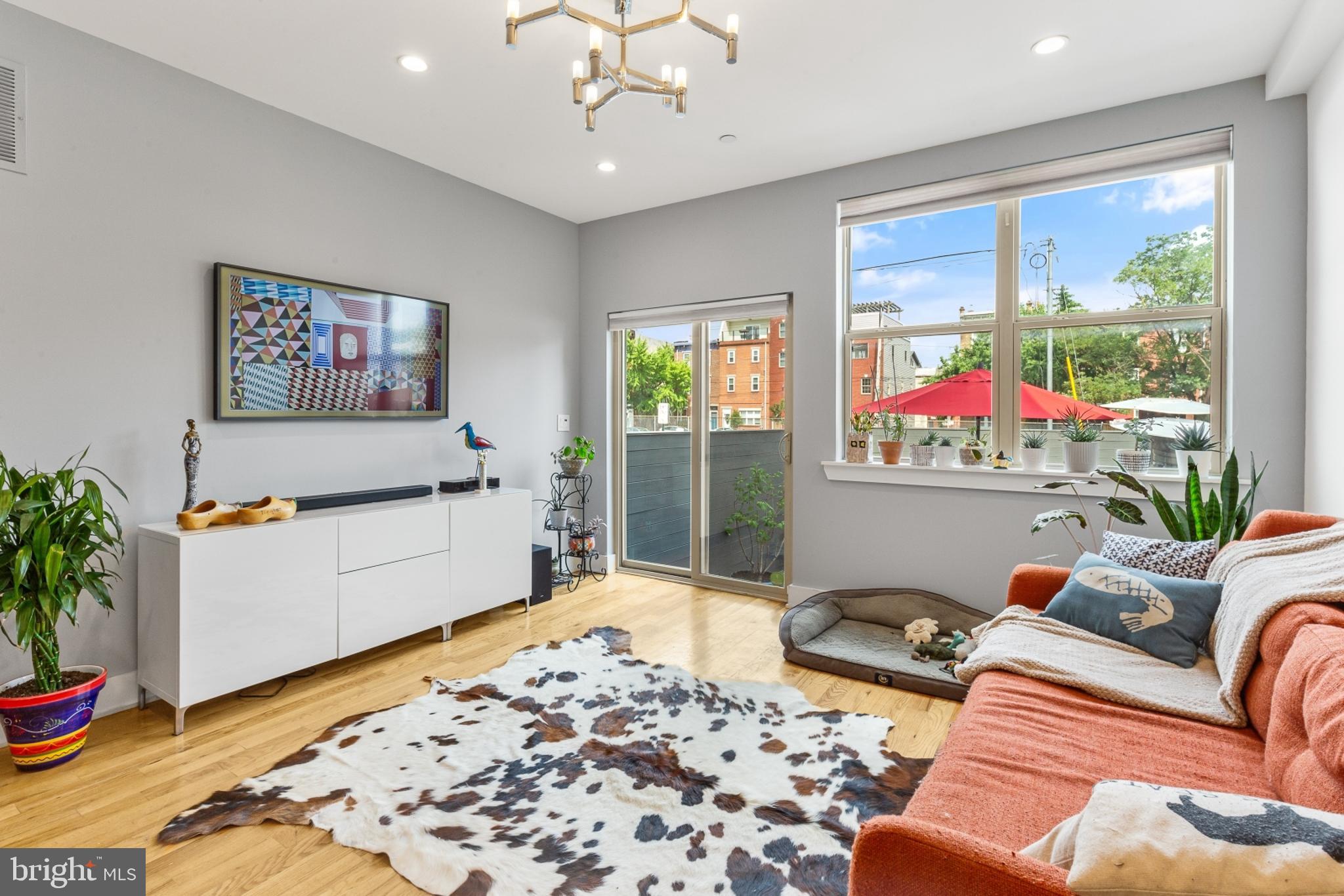 a living room with furniture rug and window