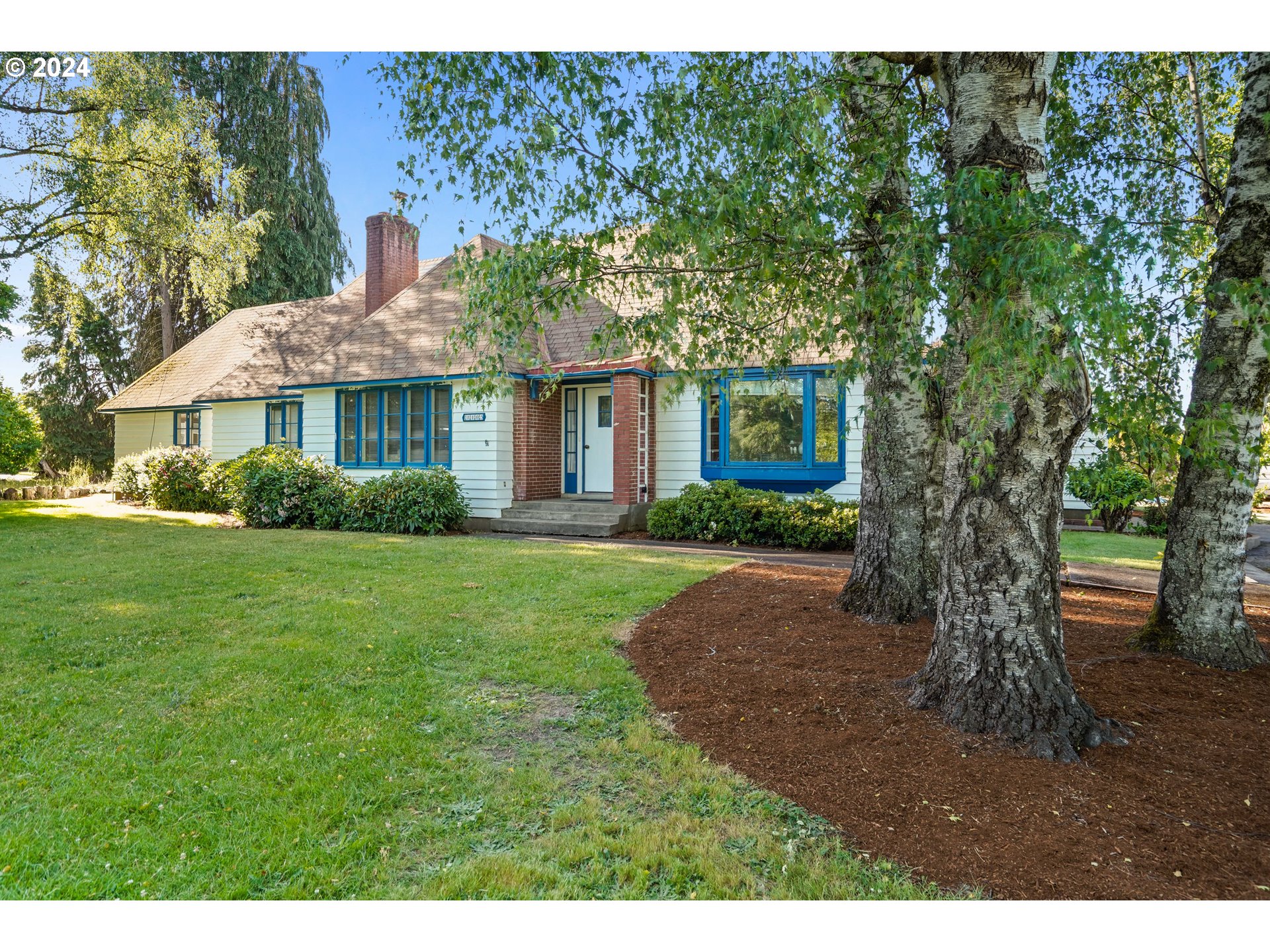 a front view of a house with garden