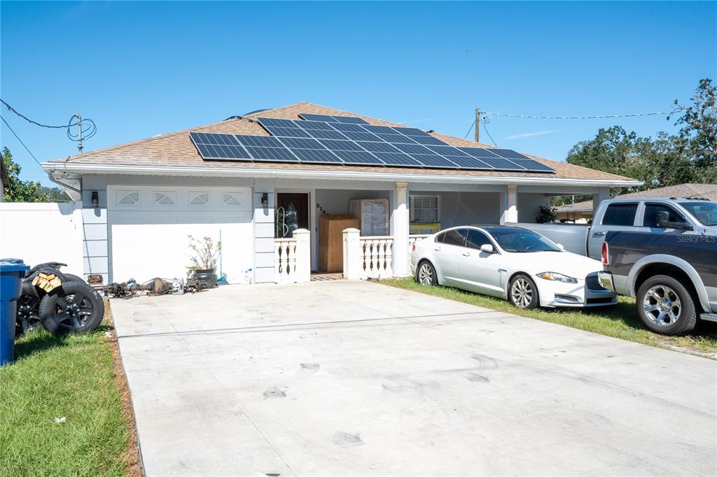 a view of a car parked in front of a house