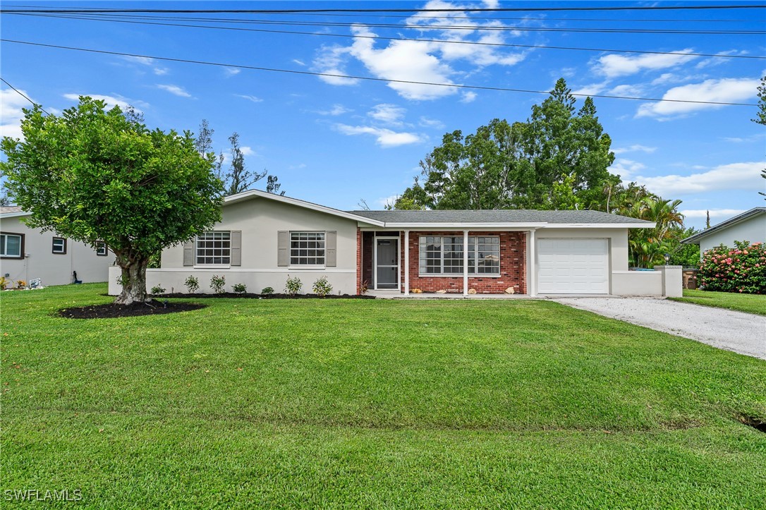 a view of a house with a back yard