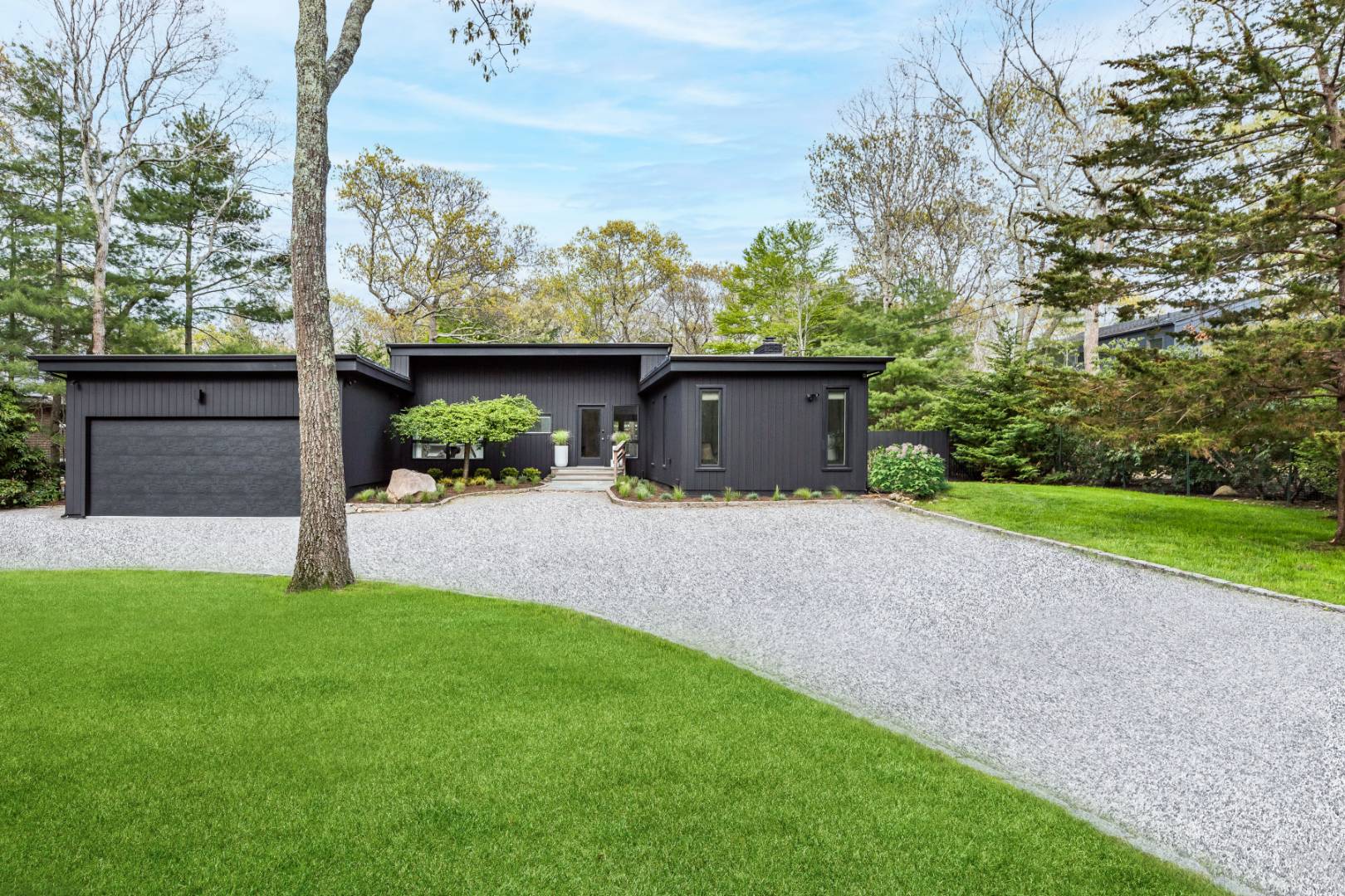 a view of a garden with an outdoor seating