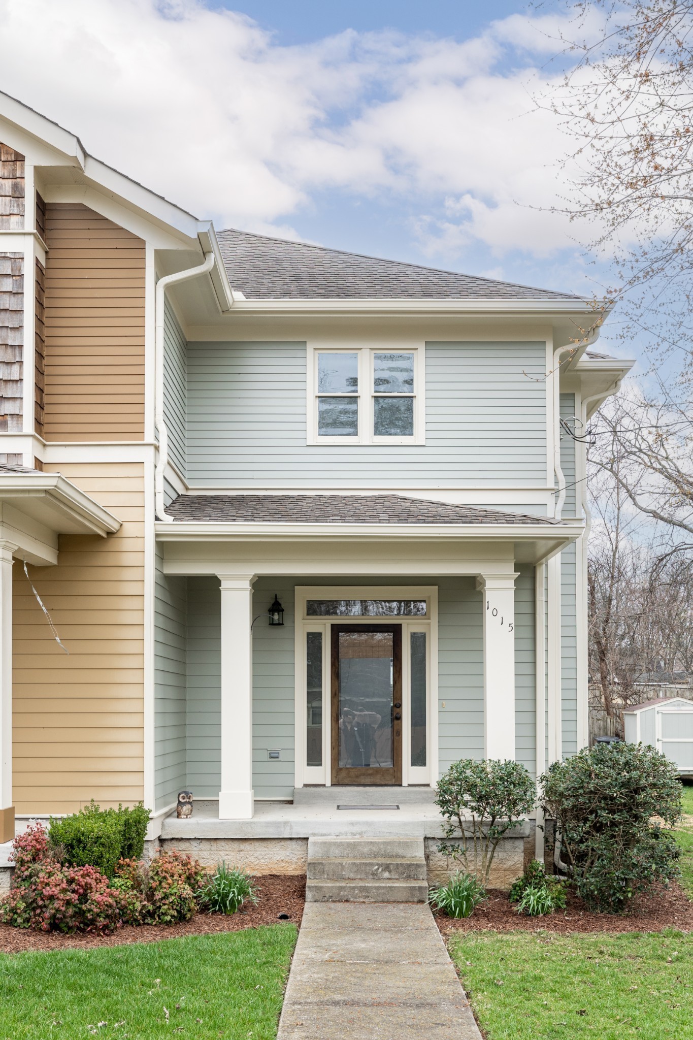 1015 N 14th St with fresh exterior paint, beautiful wood door and an inviting front porch