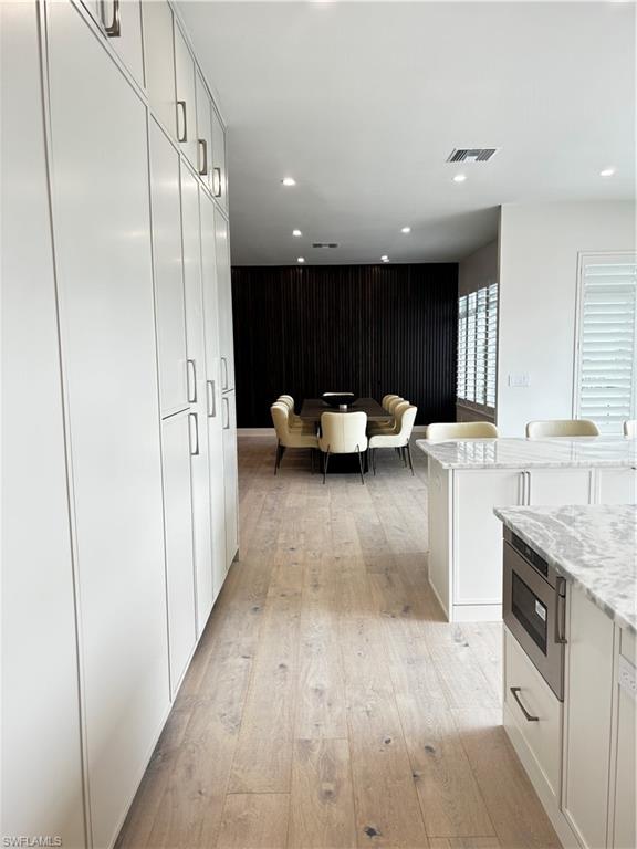 a kitchen with stainless steel appliances granite countertop a refrigerator sink and cabinets