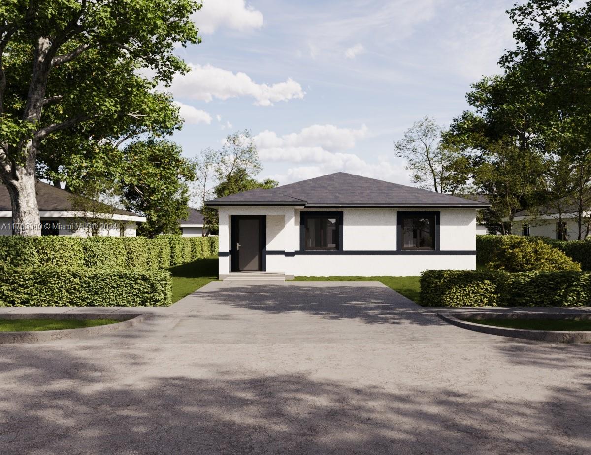 a front view of a house with a garden