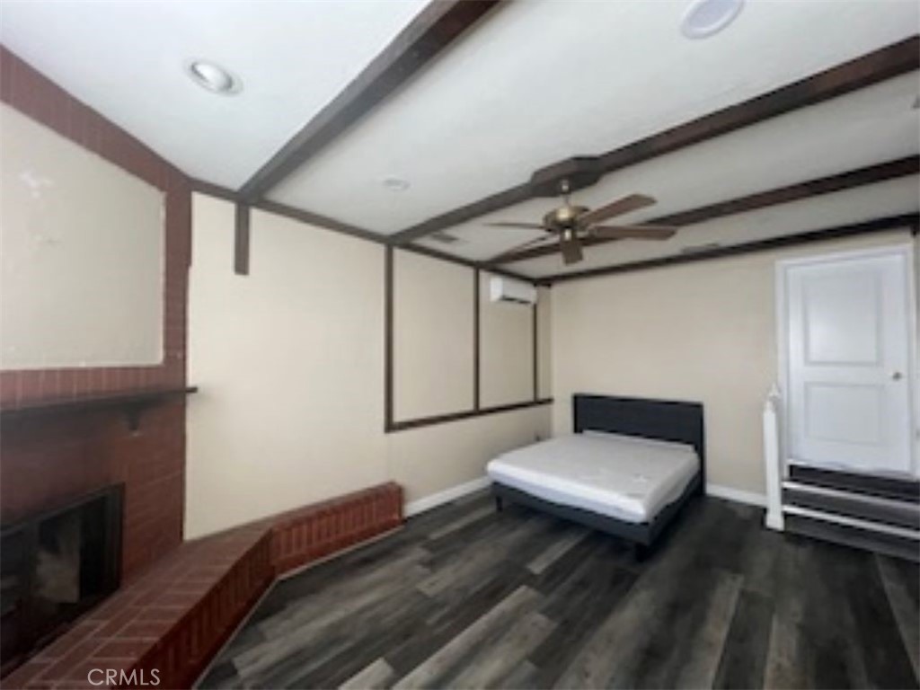 a bedroom with a bed and a ceiling fan