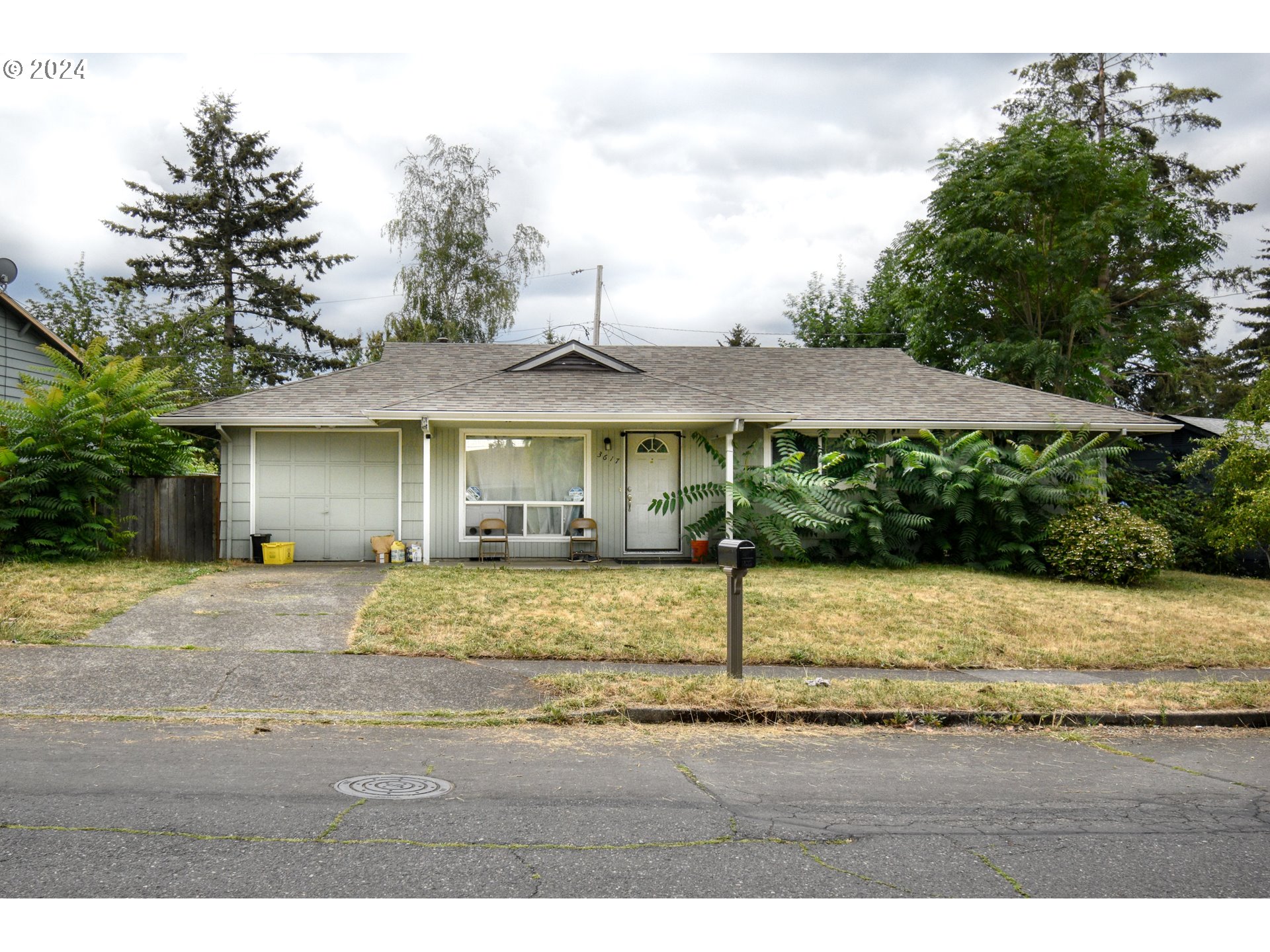 a front view of a house with garden