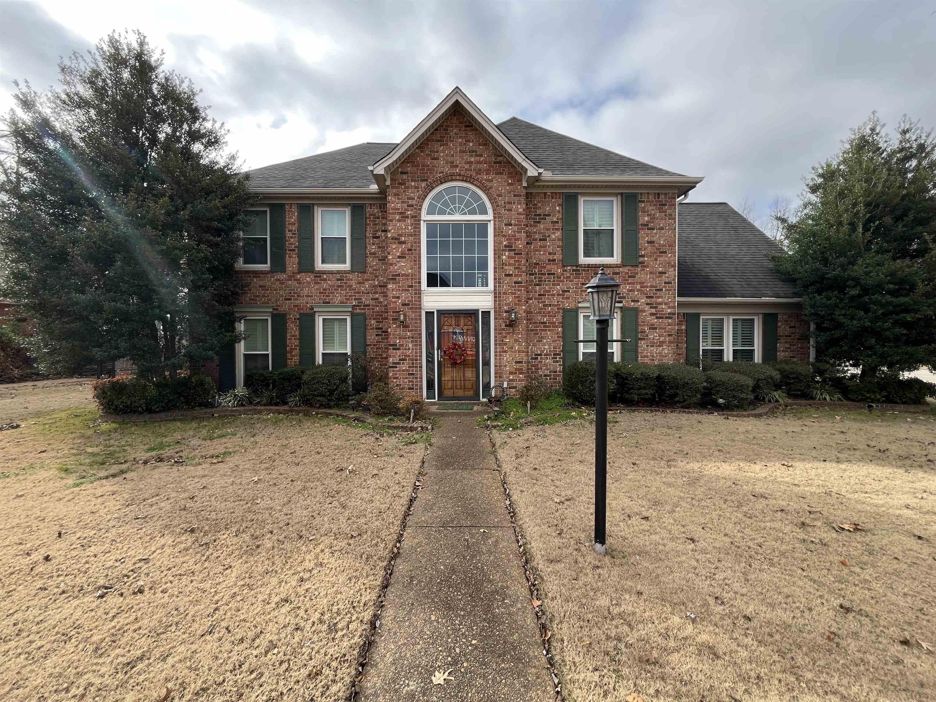 a front view of a house with a yard