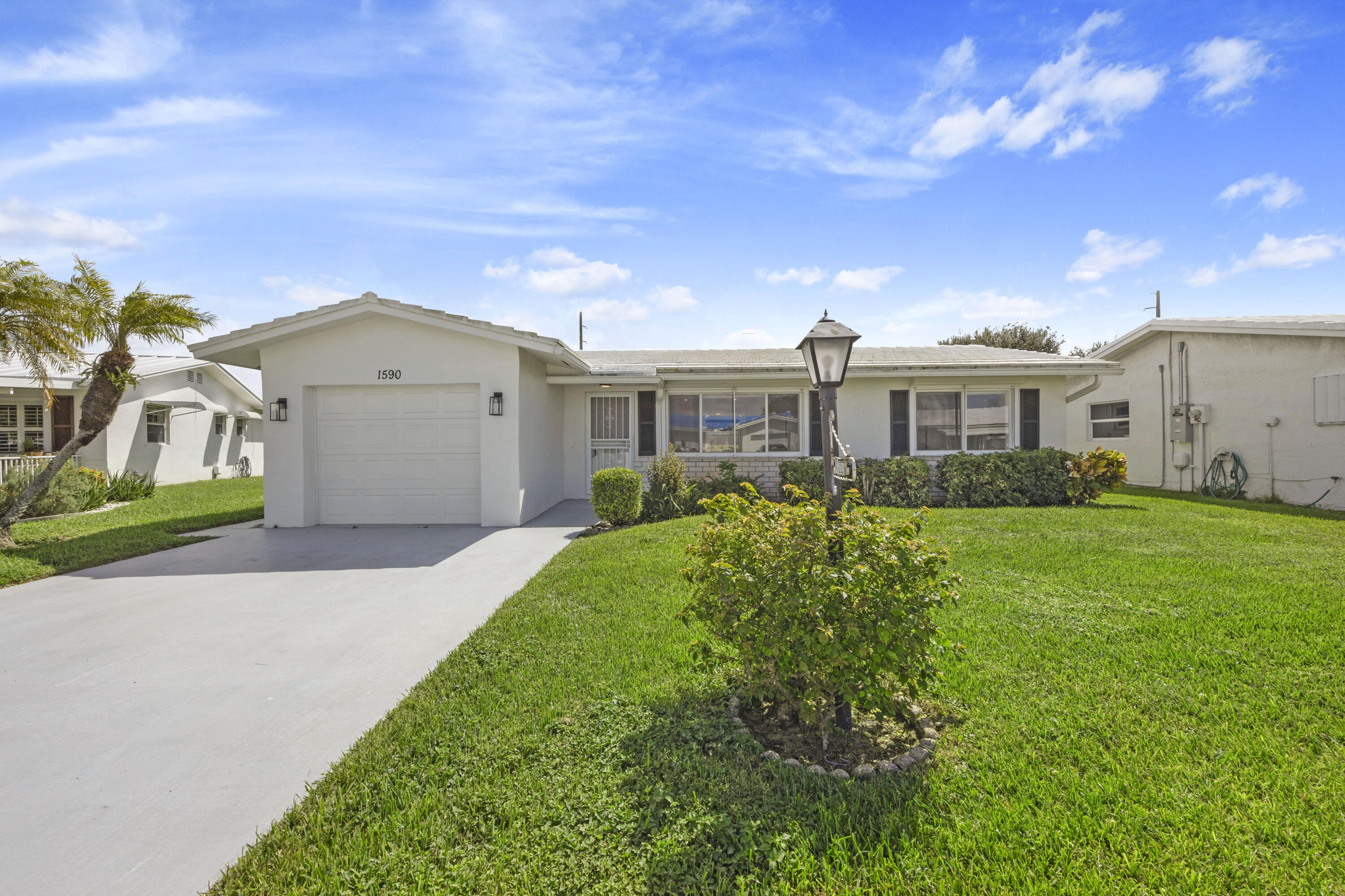 a view of yard in front of house with a yard