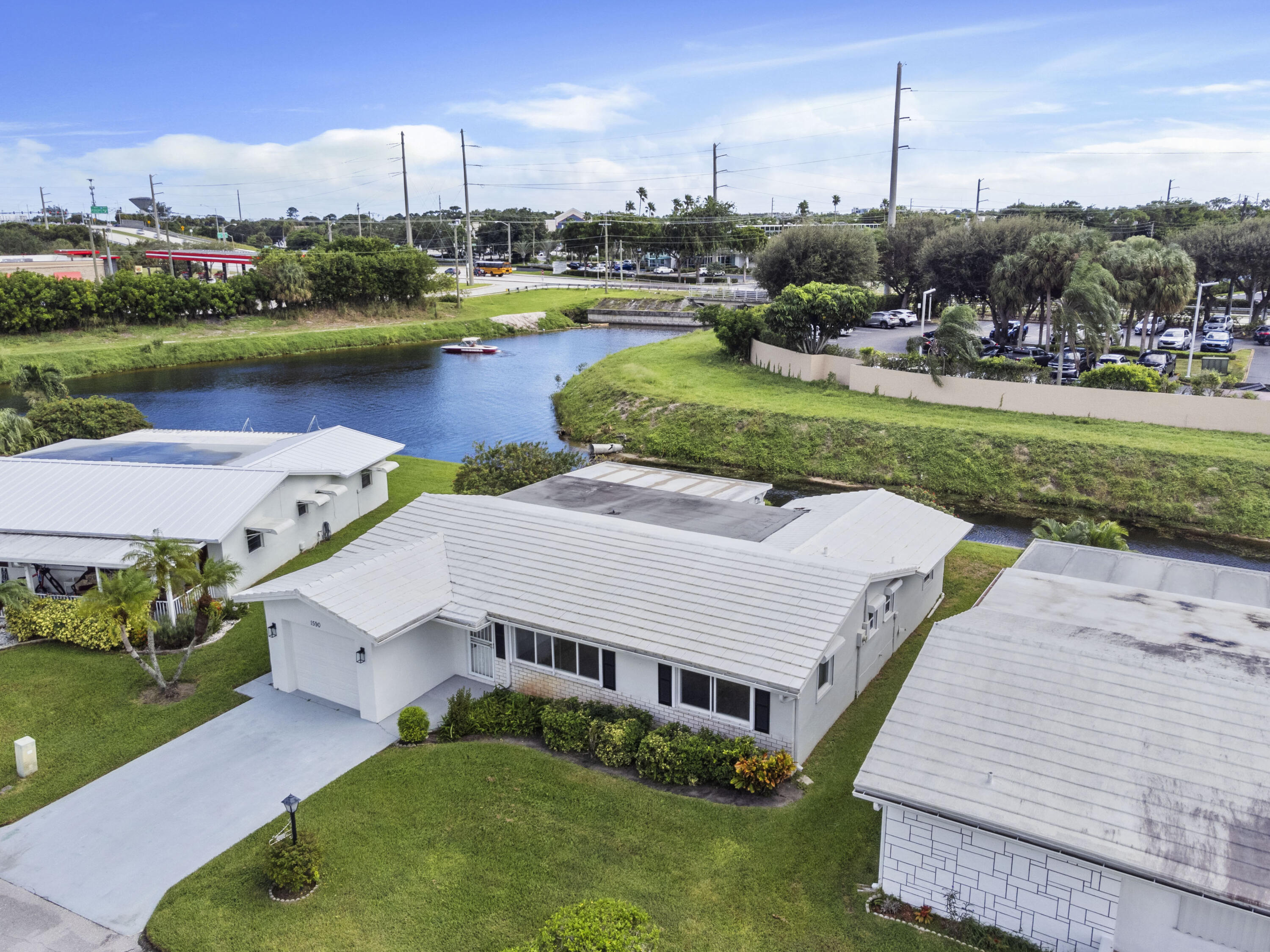 an aerial view of a house with swimming pool garden and outdoor seating