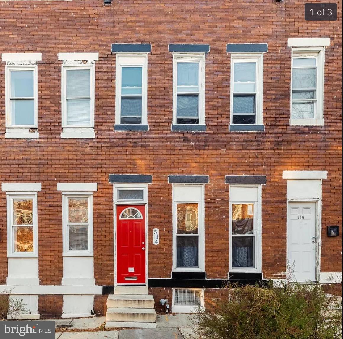 a view of a brick building with many windows