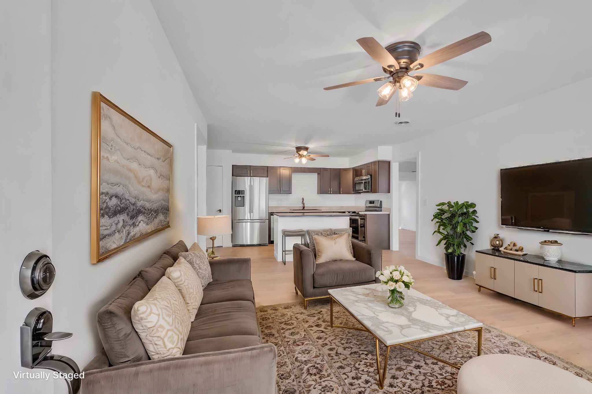 a living room with furniture and a flat screen tv