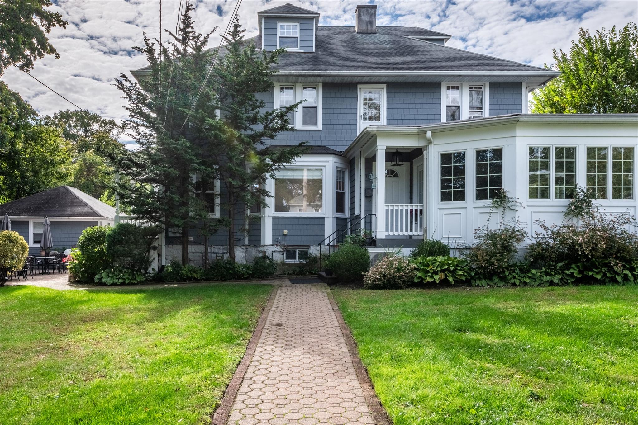 a front view of a house with garden