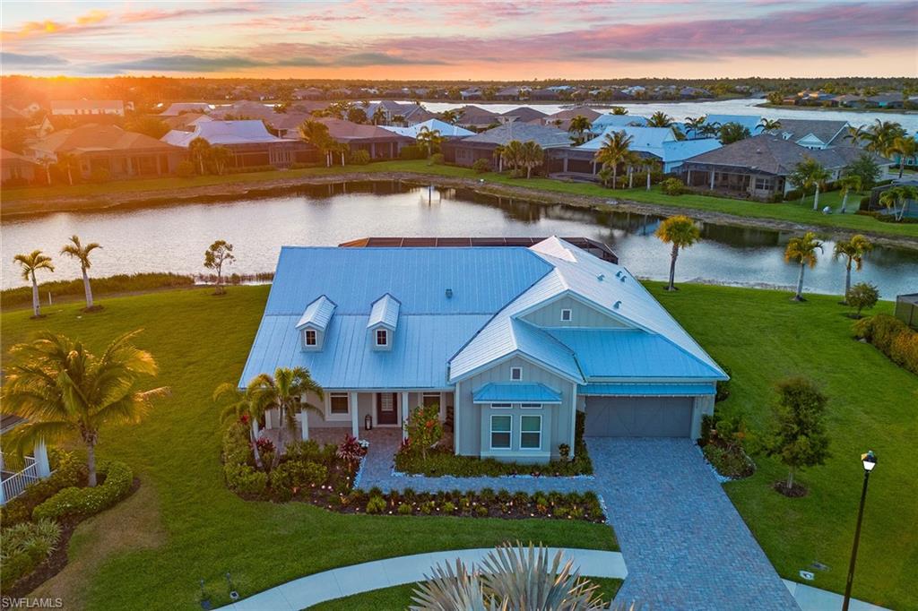 an aerial view of a house with a lake view