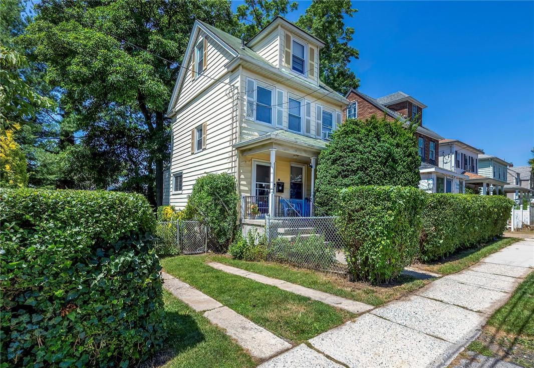 Front of home with parking area and porch