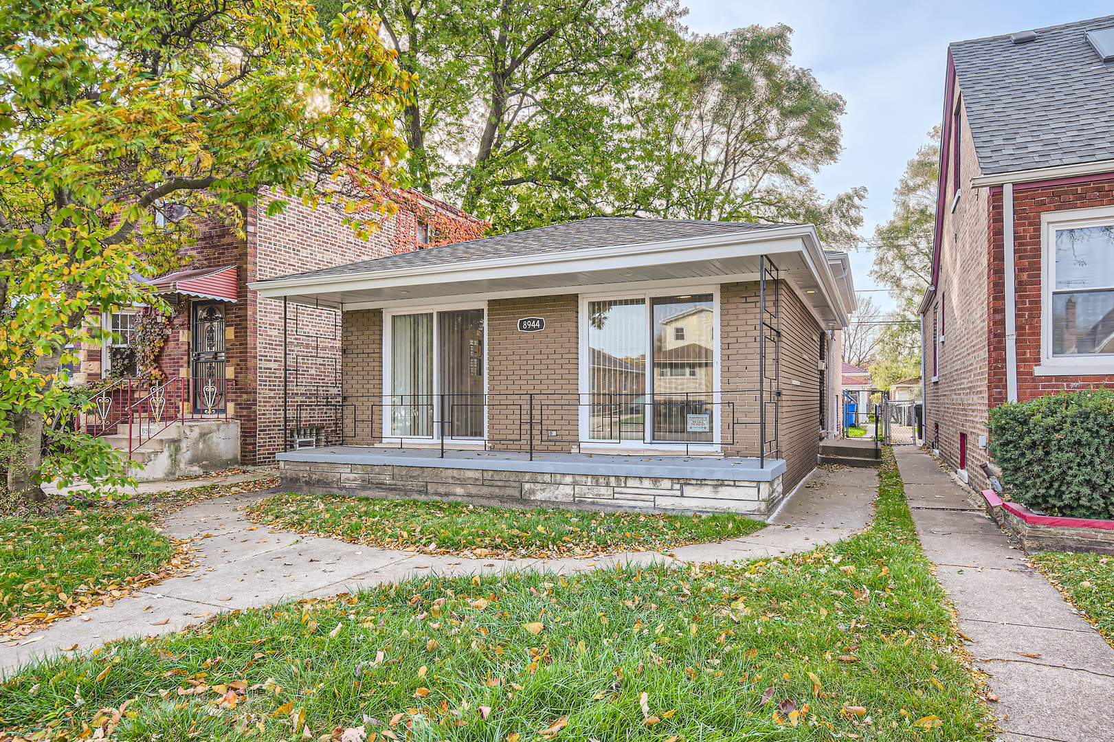 front view of a house with a yard