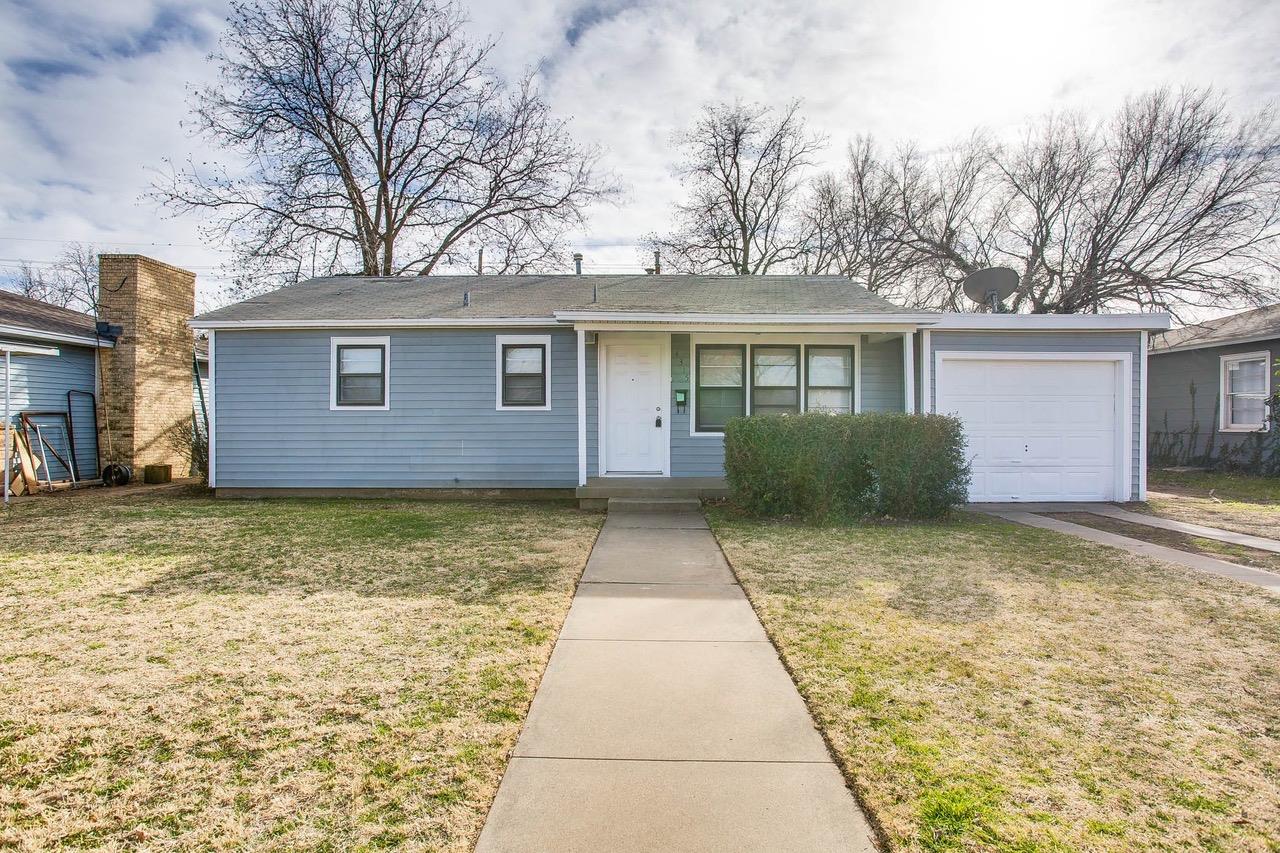 front view of house next to a yard