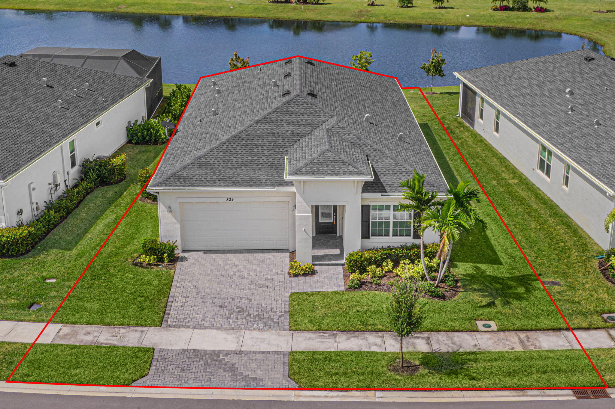 a aerial view of a house with a yard