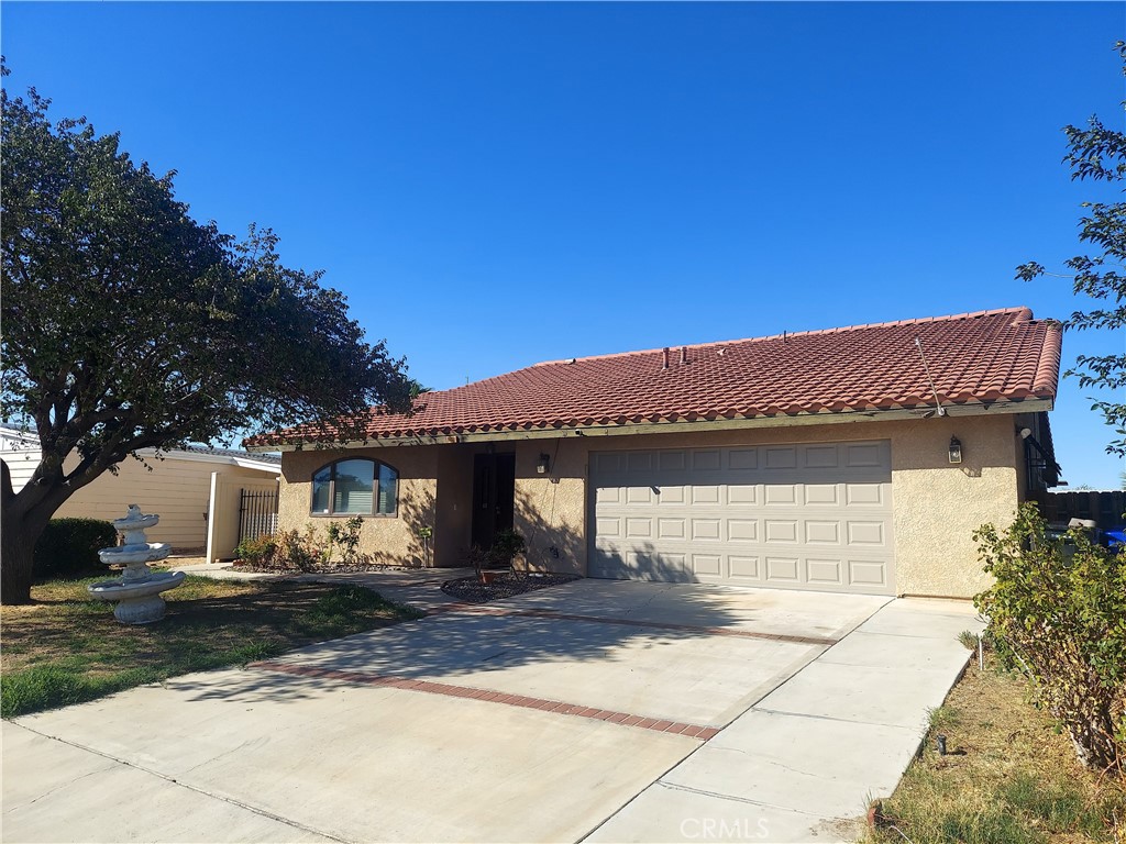 a front view of a house with garage