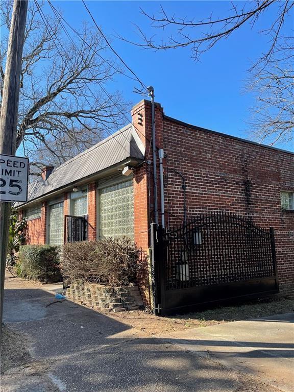 a view of a brick house with a street