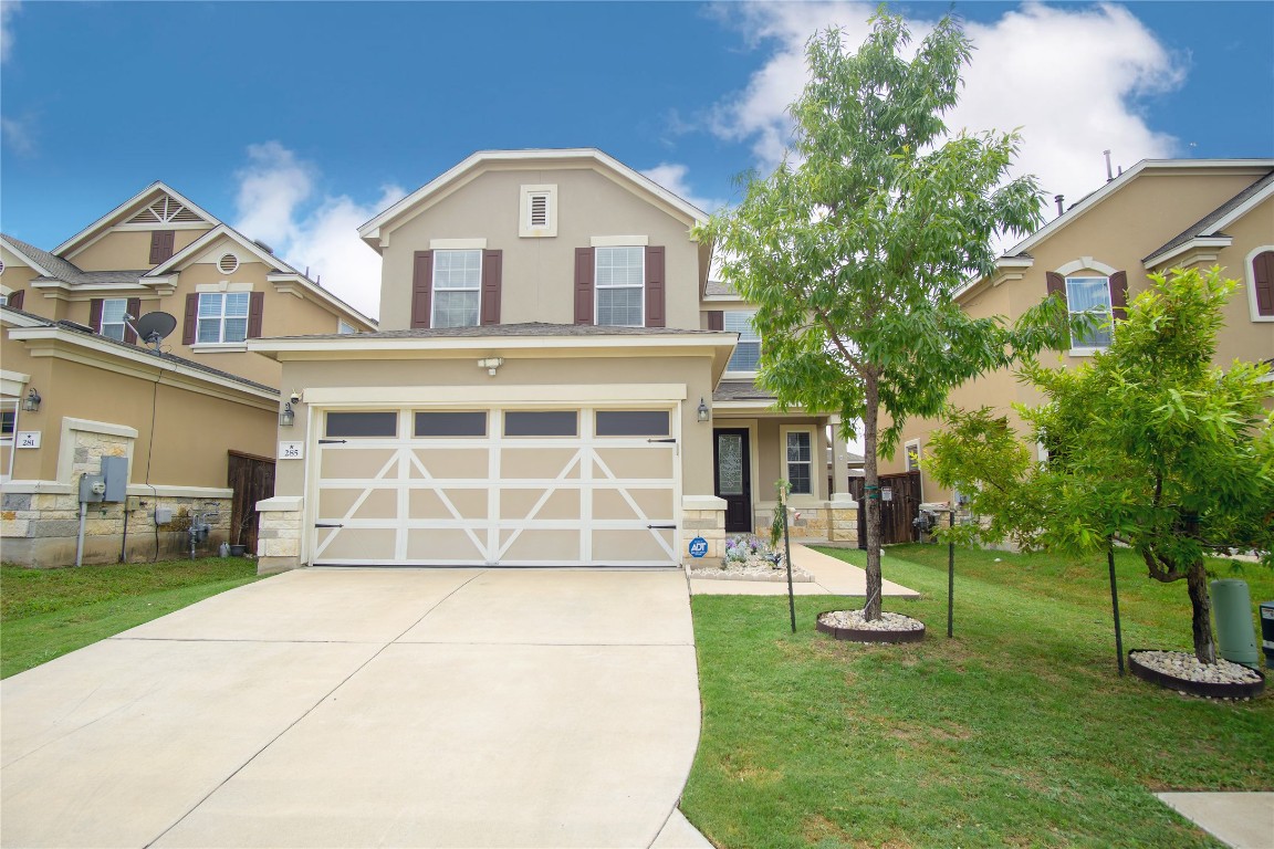 front view of a house with a yard