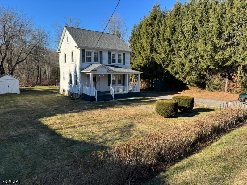 a house with trees in front of it