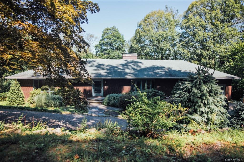 a view of a house with a flower garden