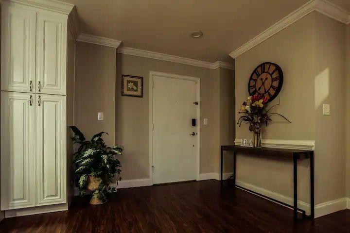 a view of a hallway with wooden floor