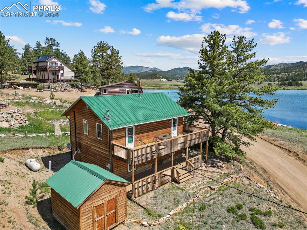 an aerial view of a house with a big yard