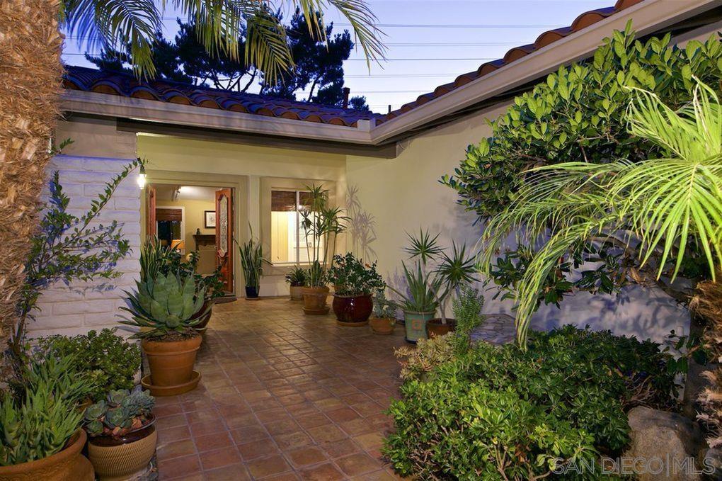 a view of a entryway with flower plants