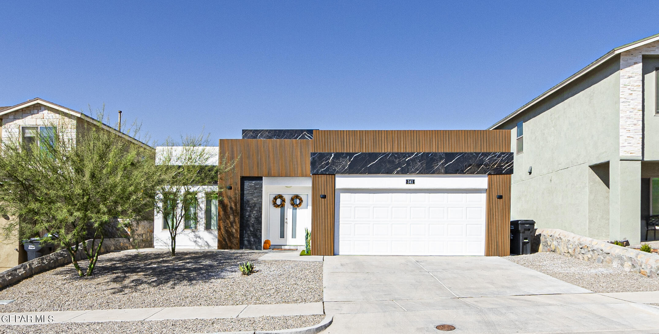 a view of a house with a garage