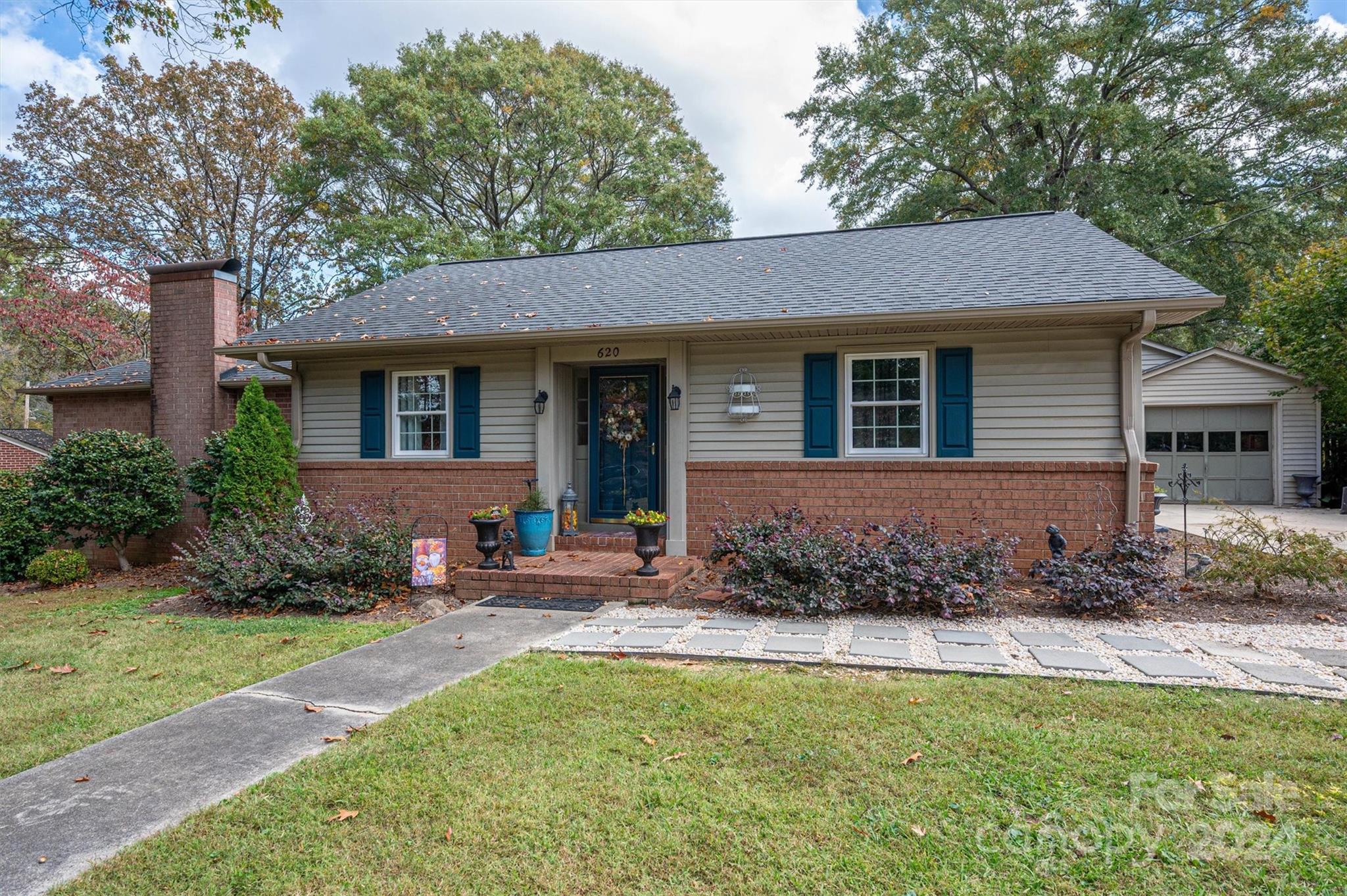 a front view of a house with garden