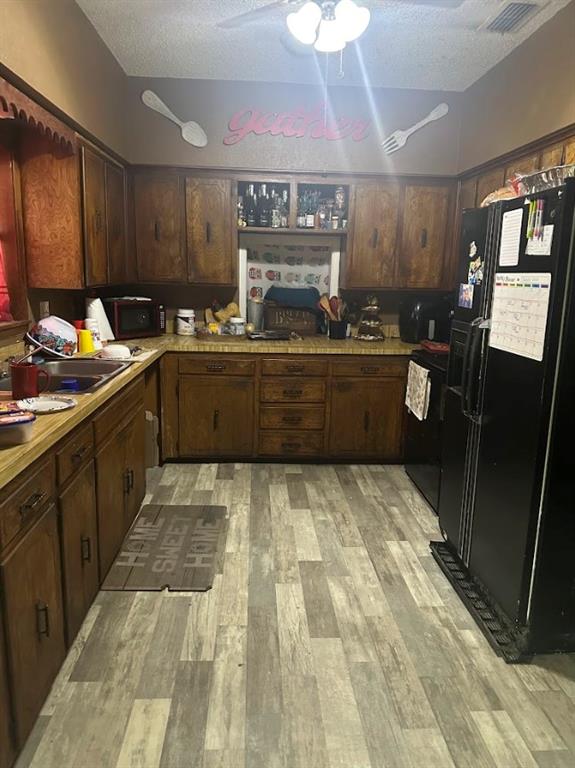 a kitchen with sink and cabinets