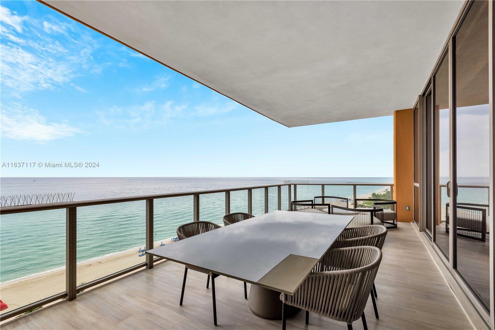 a view of a balcony with chairs