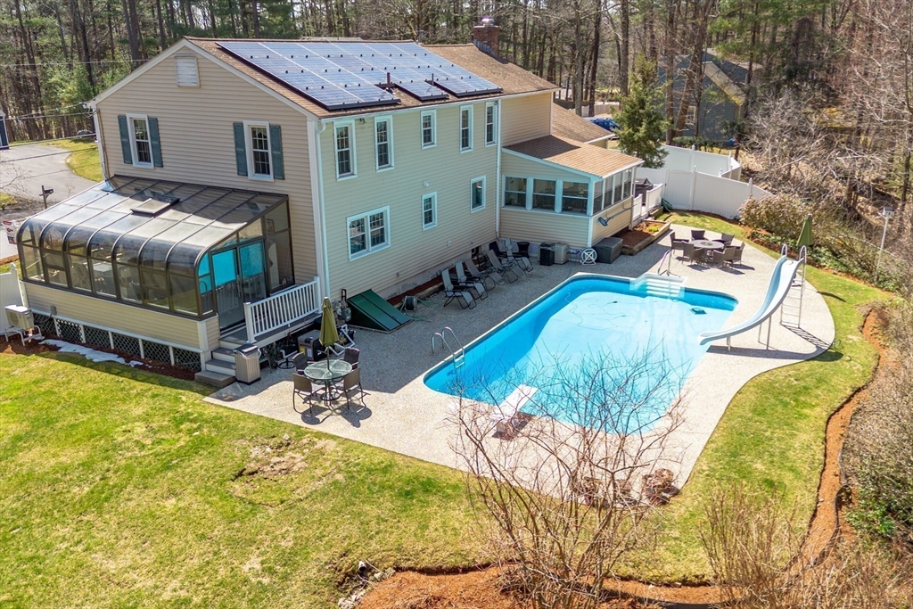 a aerial view of a house with swimming pool