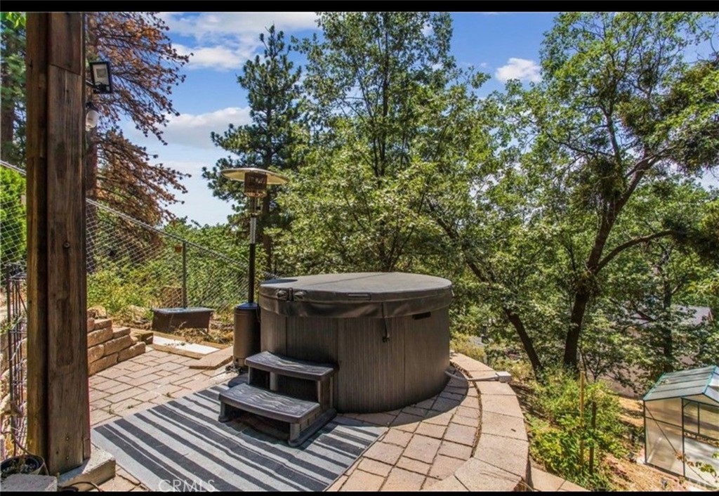 a view of a backyard with sitting area