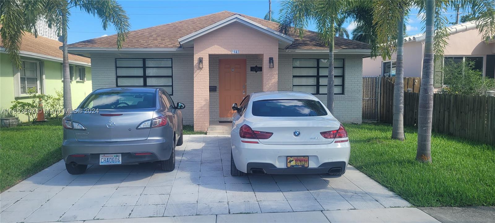 a car parked in front of a house